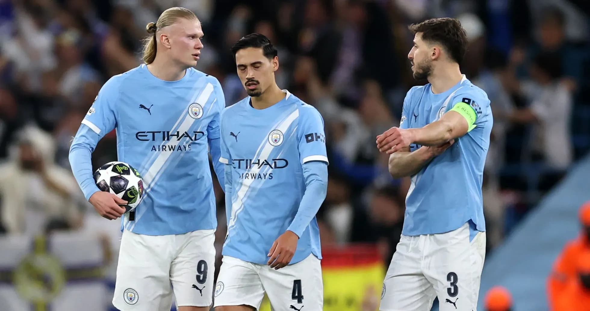 Manchester City players discussing during a match Manchester City players discussing during a match
