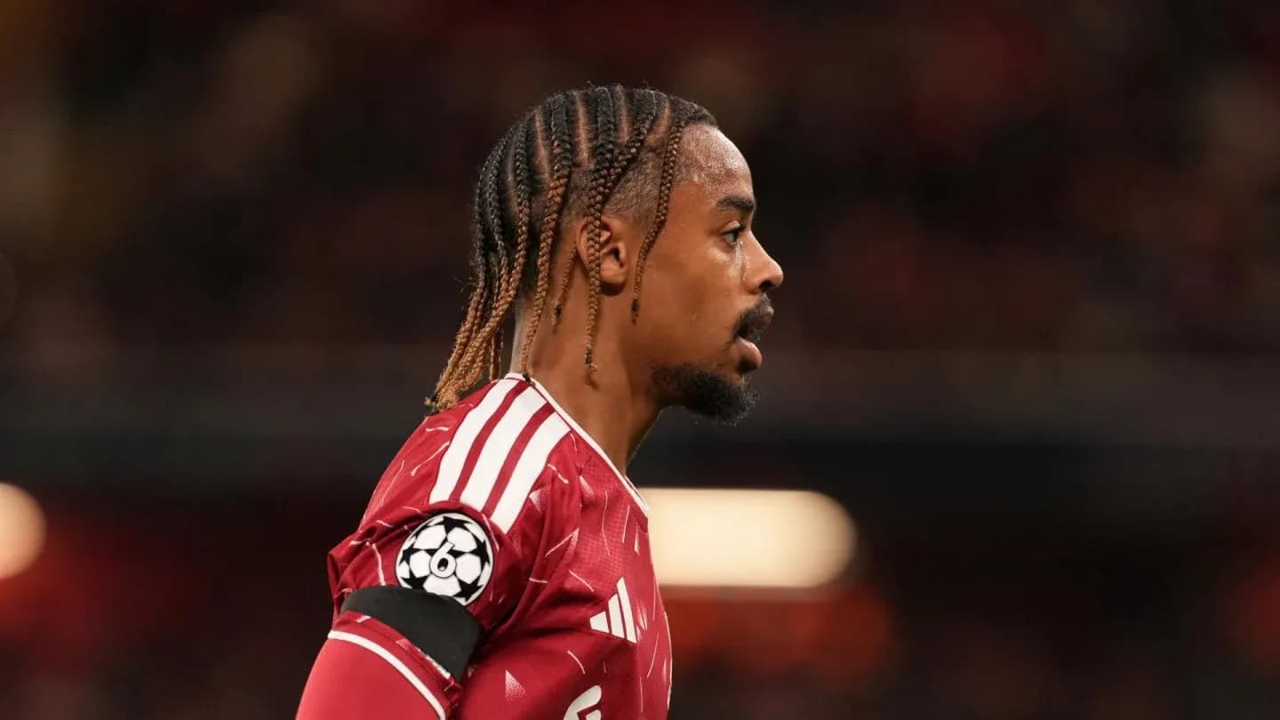 Player in red jersey during match with Champions League badge Player in red jersey during match with Champions League badge