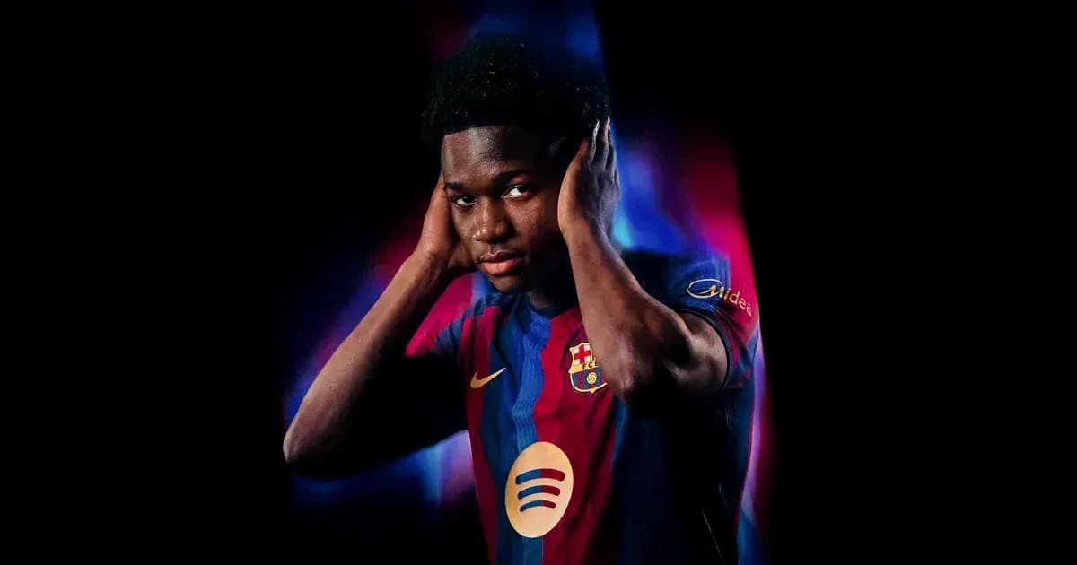 Player posing in FC Barcelona jersey with hands on ears Player posing in FC Barcelona jersey with hands on ears