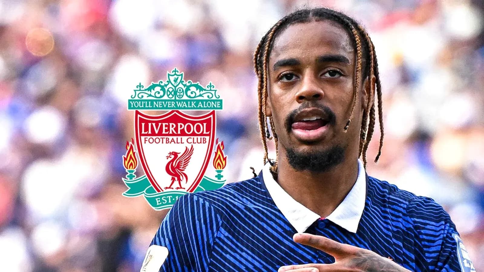 Player gesturing with Liverpool FC logo in background Player gesturing with Liverpool FC logo in background
