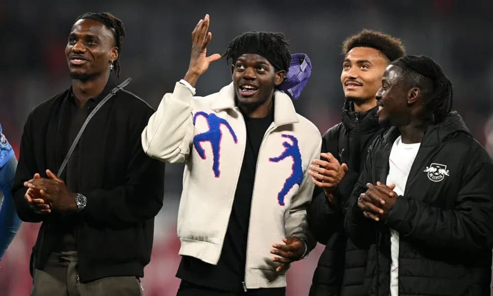 Four players celebrating together at a stadium Four players celebrating together at a stadium