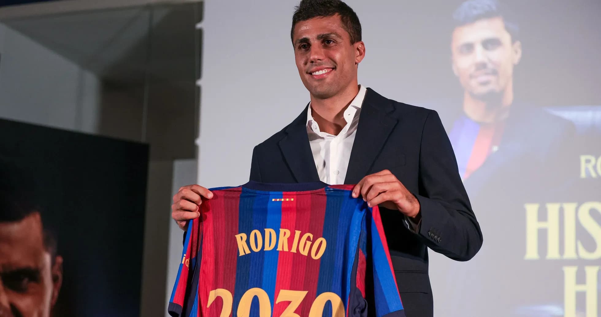 Player presenting Barcelona jersey with 'Rodrigo 2030' Player presenting Barcelona jersey with 'Rodrigo 2030'