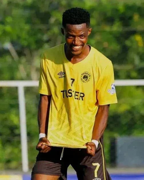 Player celebrating in yellow team jersey outdoors Player celebrating in yellow team jersey outdoors