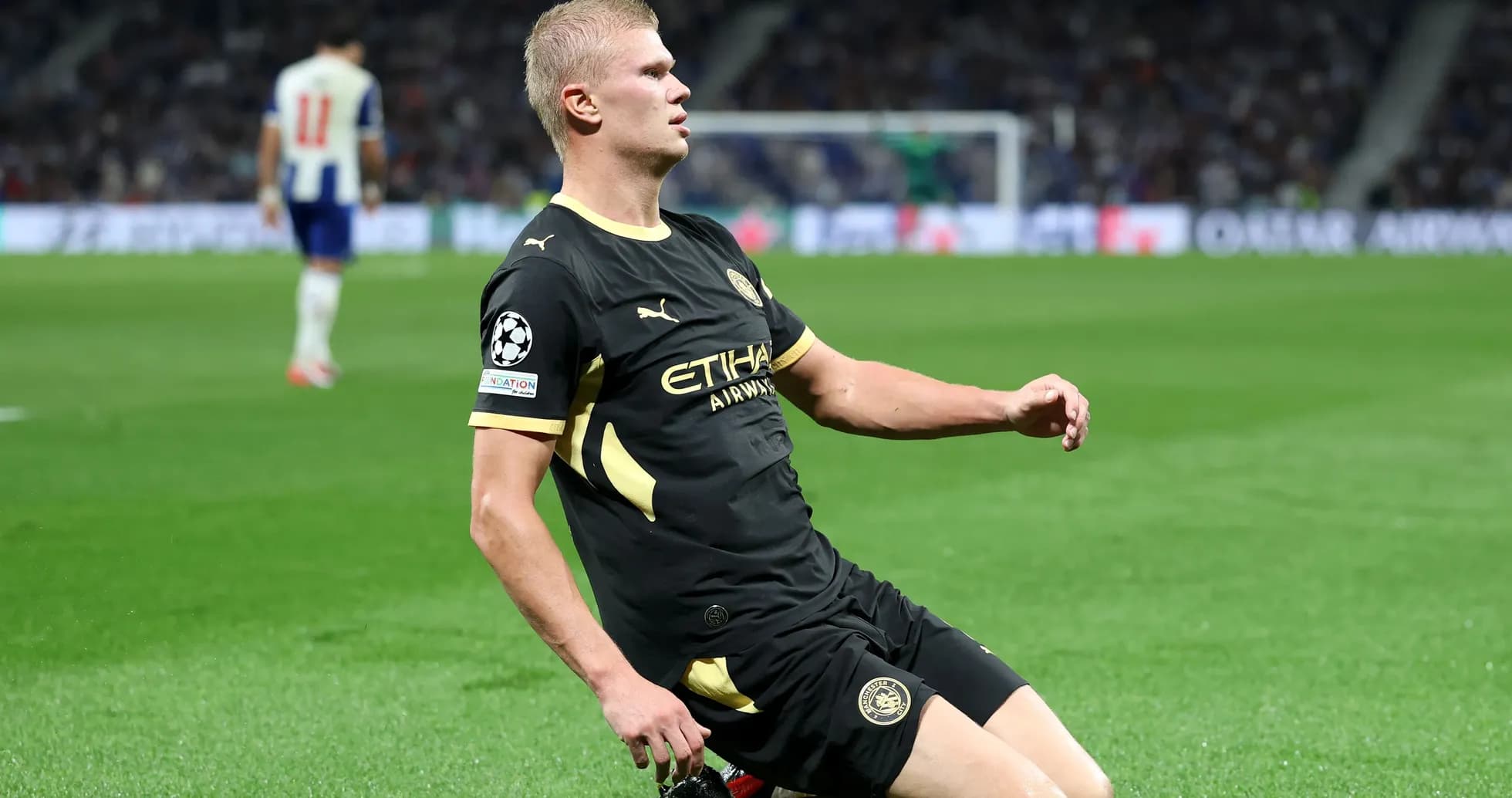 Player sliding on field during Champions League match Player sliding on field during Champions League match