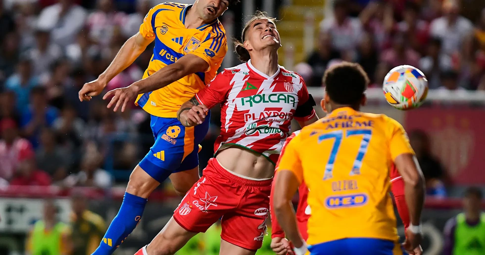 Players contesting for the ball during Liga MX match Players contesting for the ball during Liga MX match
