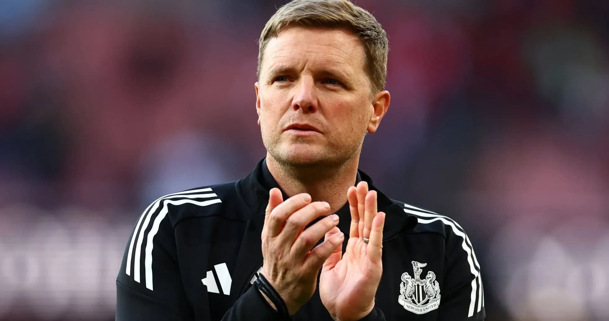 Manager applauding during a match at stadium Manager applauding during a match at stadium
