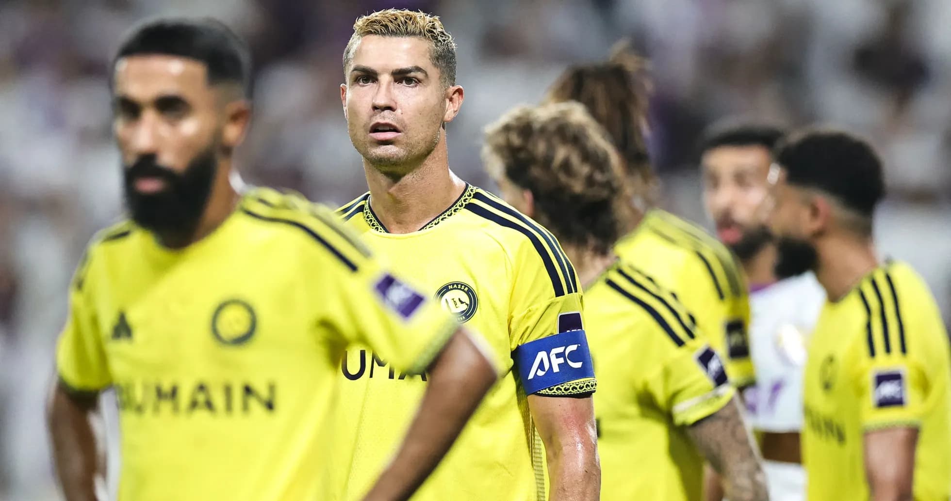 Players in yellow jerseys during a match Players in yellow jerseys during a match