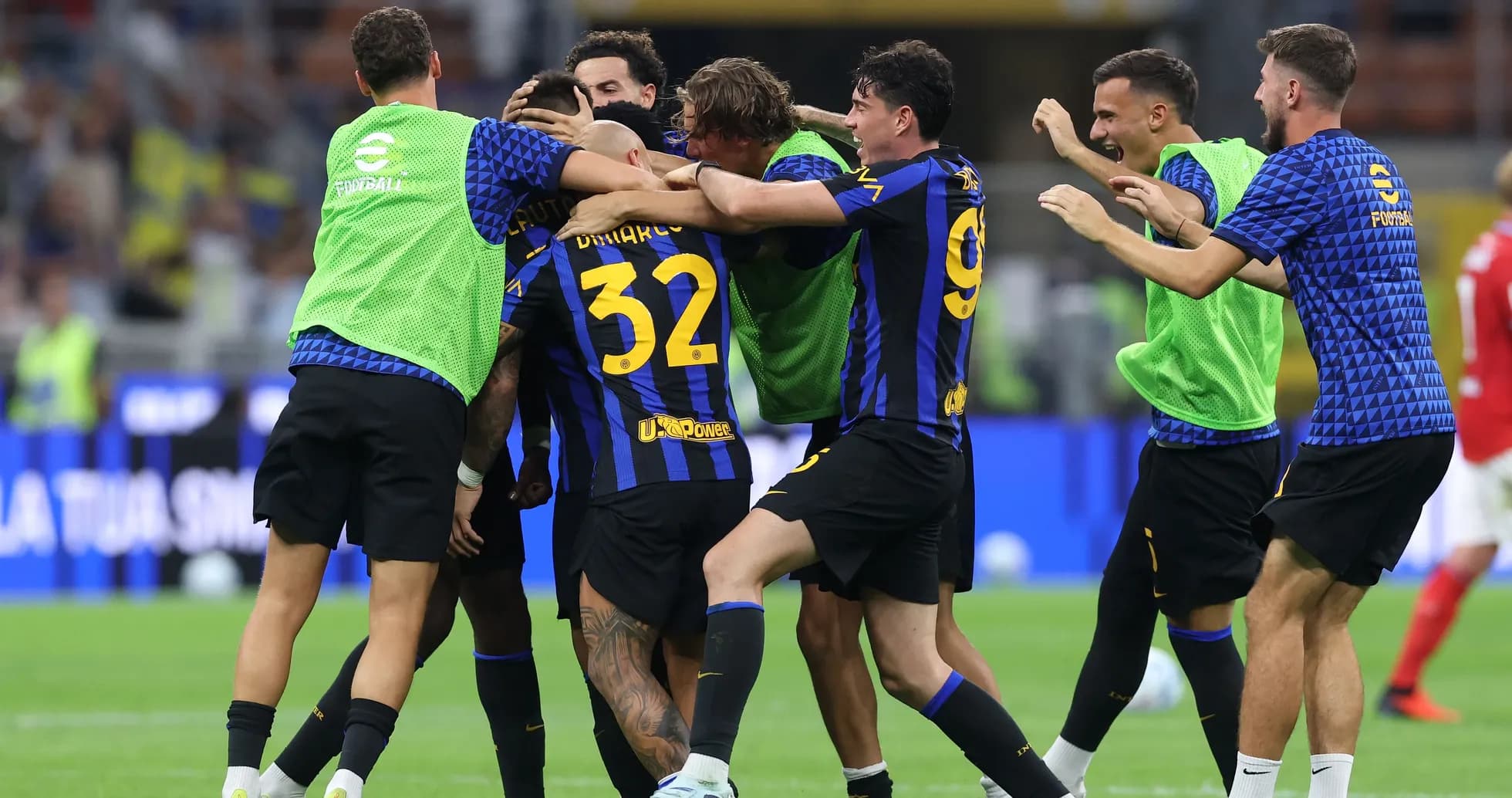 Players celebrating a goal on the field Players celebrating a goal on the field