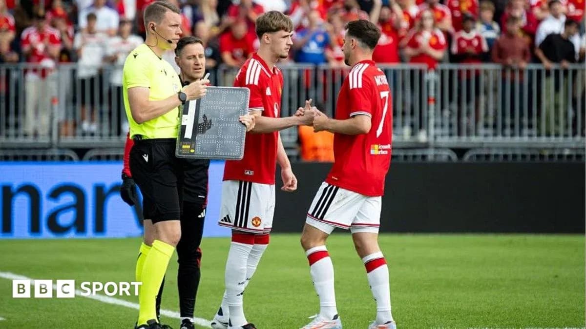 Players exchanging handshakes during substitution Players exchanging handshakes during substitution