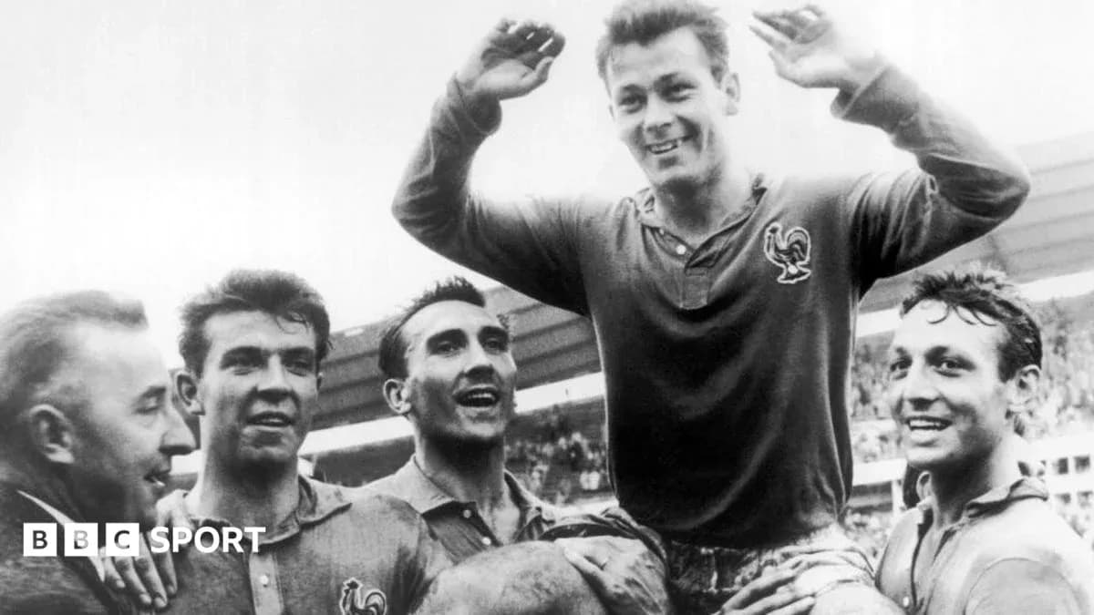 Players celebrating a victory with one player lifted Players celebrating a victory with one player lifted