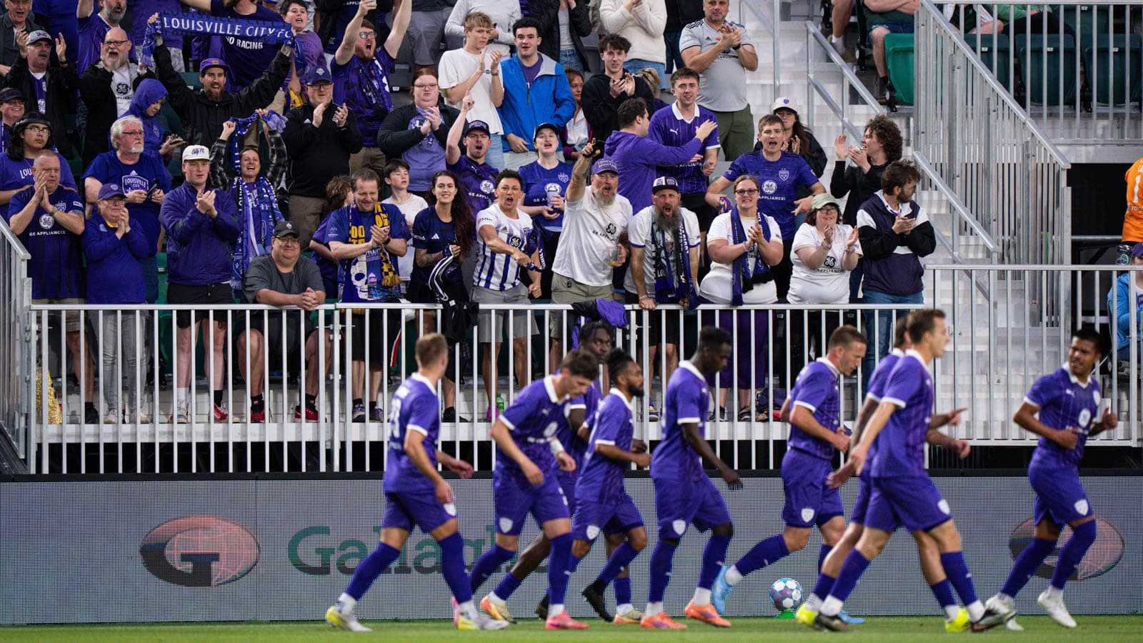 Louisville City FC fans cheering during match Louisville City FC fans cheering during match