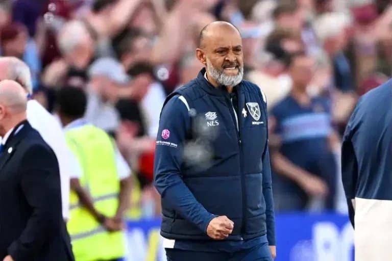 Manager celebrating on the sideline during match Manager celebrating on the sideline during match