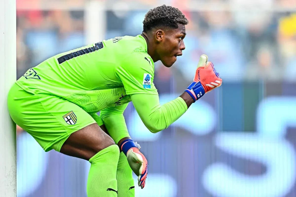 Goalkeeper in green kit signaling during match Goalkeeper in green kit signaling during match