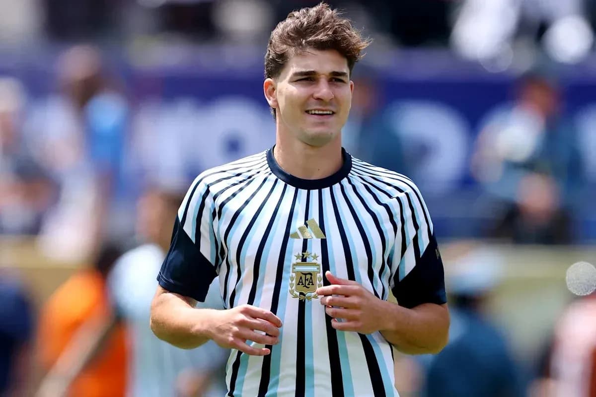 Player wearing striped Argentine jersey on field Player wearing striped Argentine jersey on field