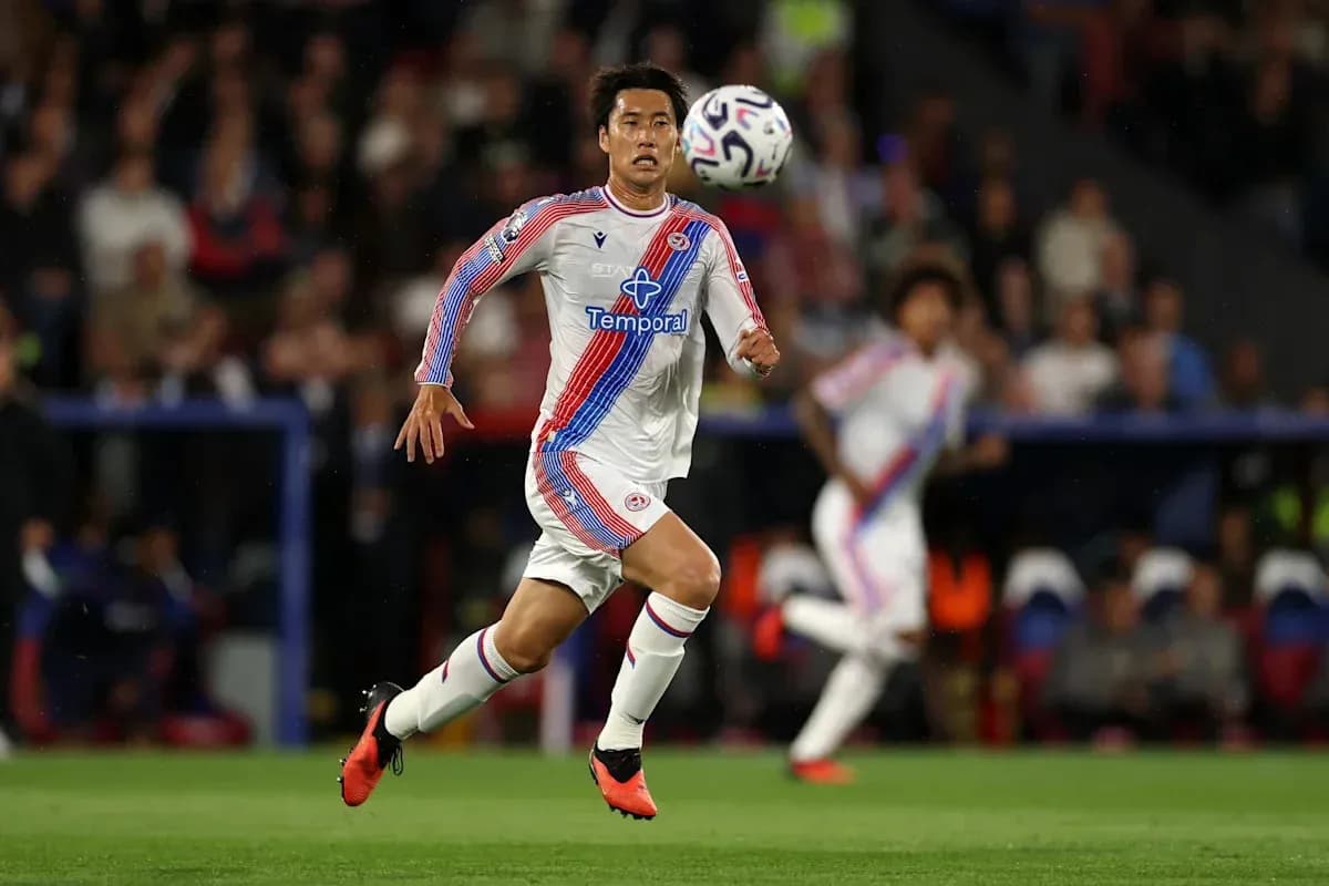 Player sprinting after the ball during a match Player sprinting after the ball during a match