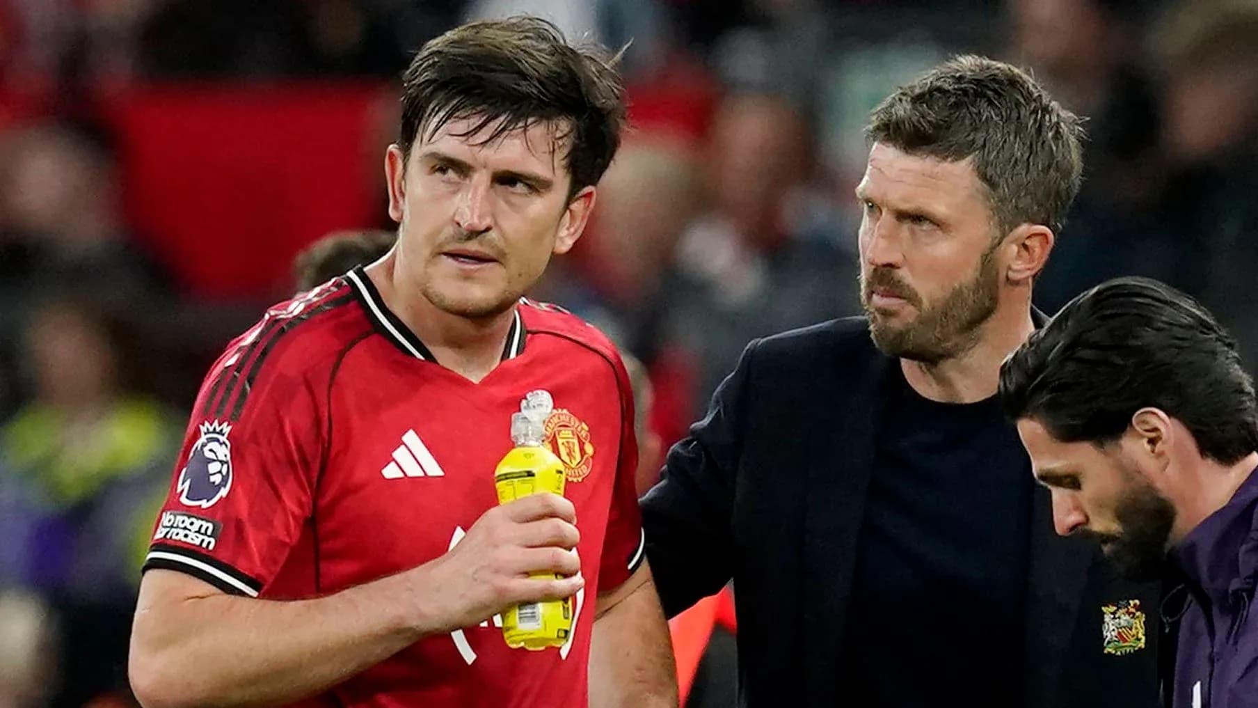 Player receiving attention from coach during match Player receiving attention from coach during match
