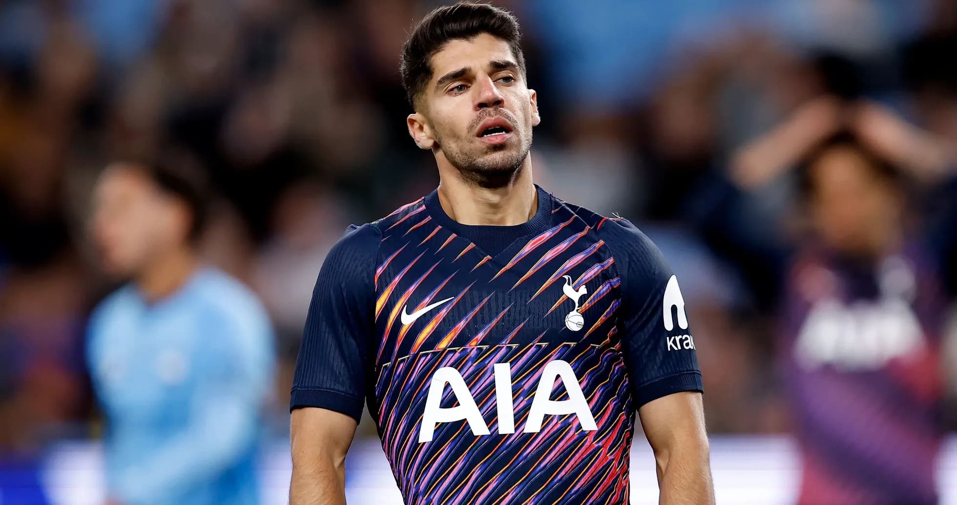 Player in Tottenham jersey during a match Player in Tottenham jersey during a match