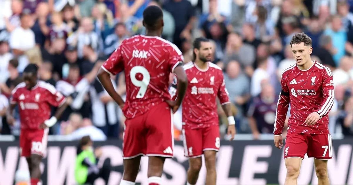Liverpool players in red jerseys during match Liverpool players in red jerseys during match