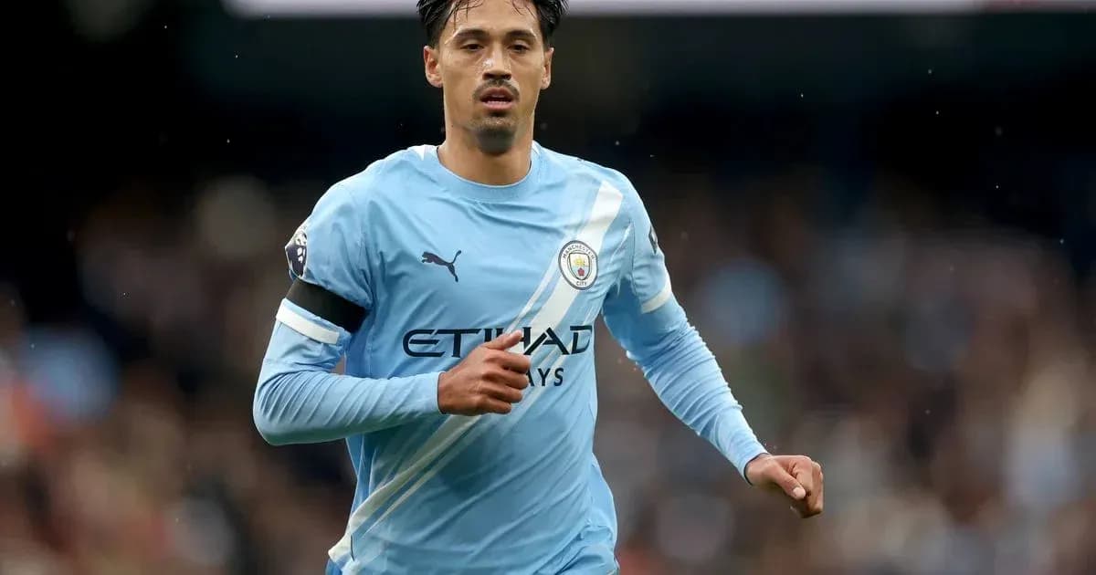 Player running in light blue Manchester City kit Player running in light blue Manchester City kit