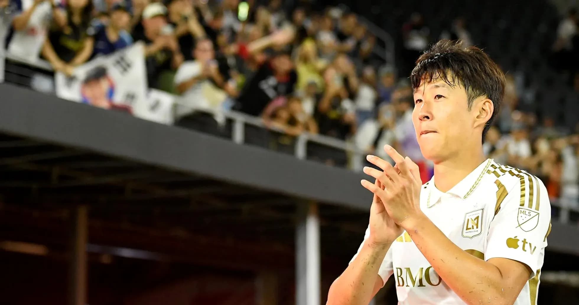 Player clapping in front of cheering fans Player clapping in front of cheering fans