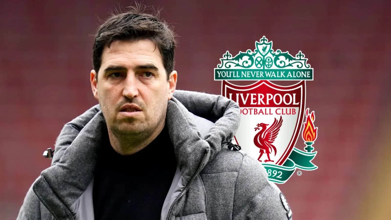 Coach standing in front of Liverpool FC logo Coach standing in front of Liverpool FC logo