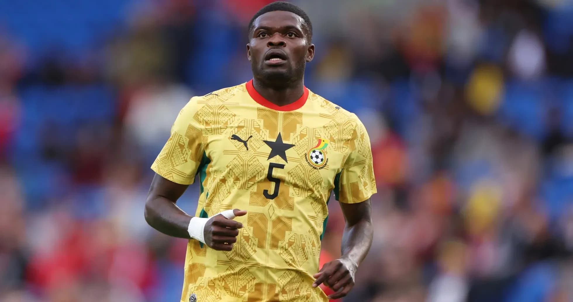 Ghana player wearing yellow jersey during match Ghana player wearing yellow jersey during match