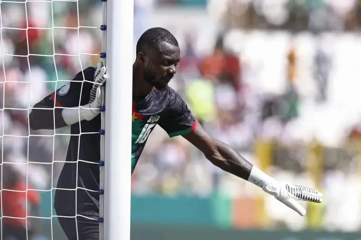 Goalkeeper signaling during a match from goalpost Goalkeeper signaling during a match from goalpost