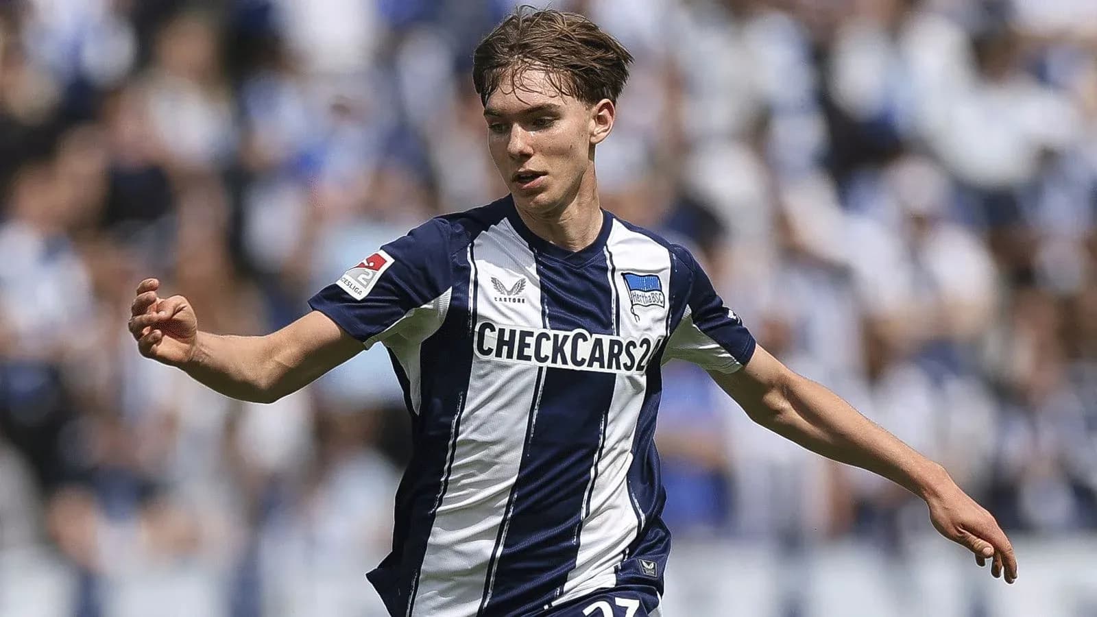 Player in Hertha BSC jersey during a match Player in Hertha BSC jersey during a match