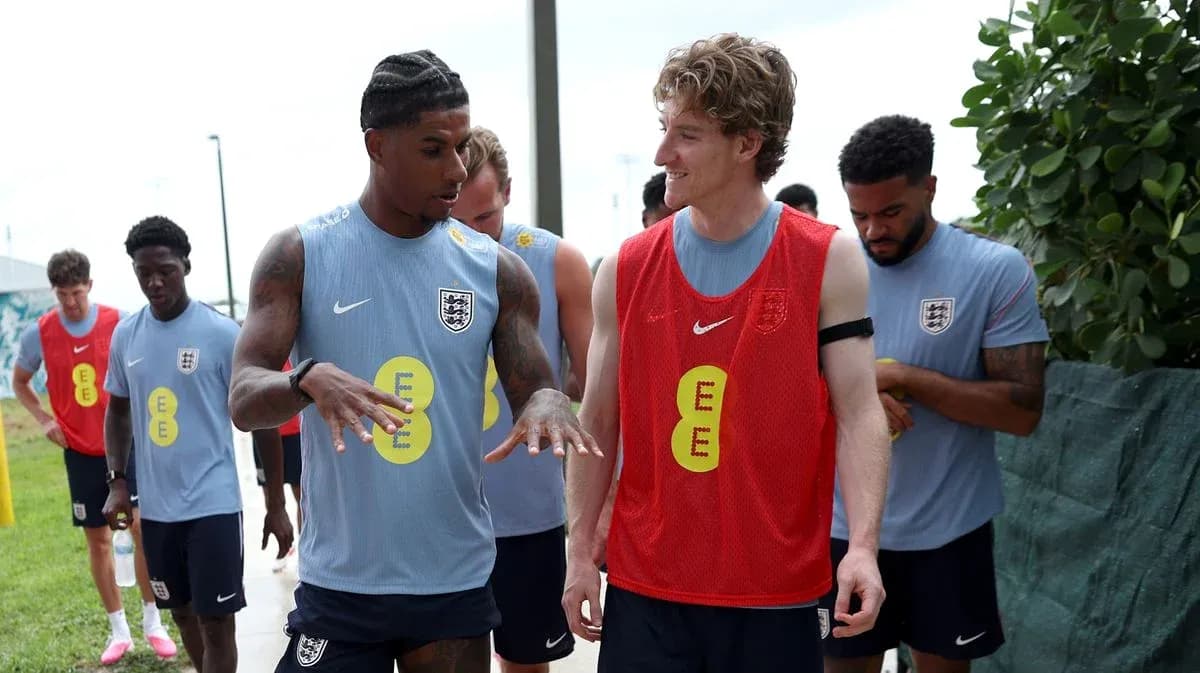 Players discussing during training session outdoors Players discussing during training session outdoors