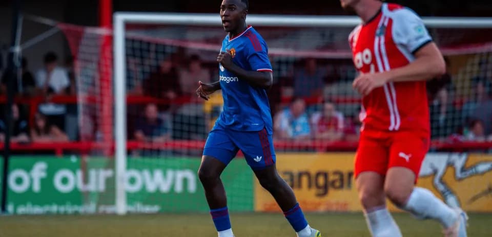 Player in blue kit running during a match Player in blue kit running during a match