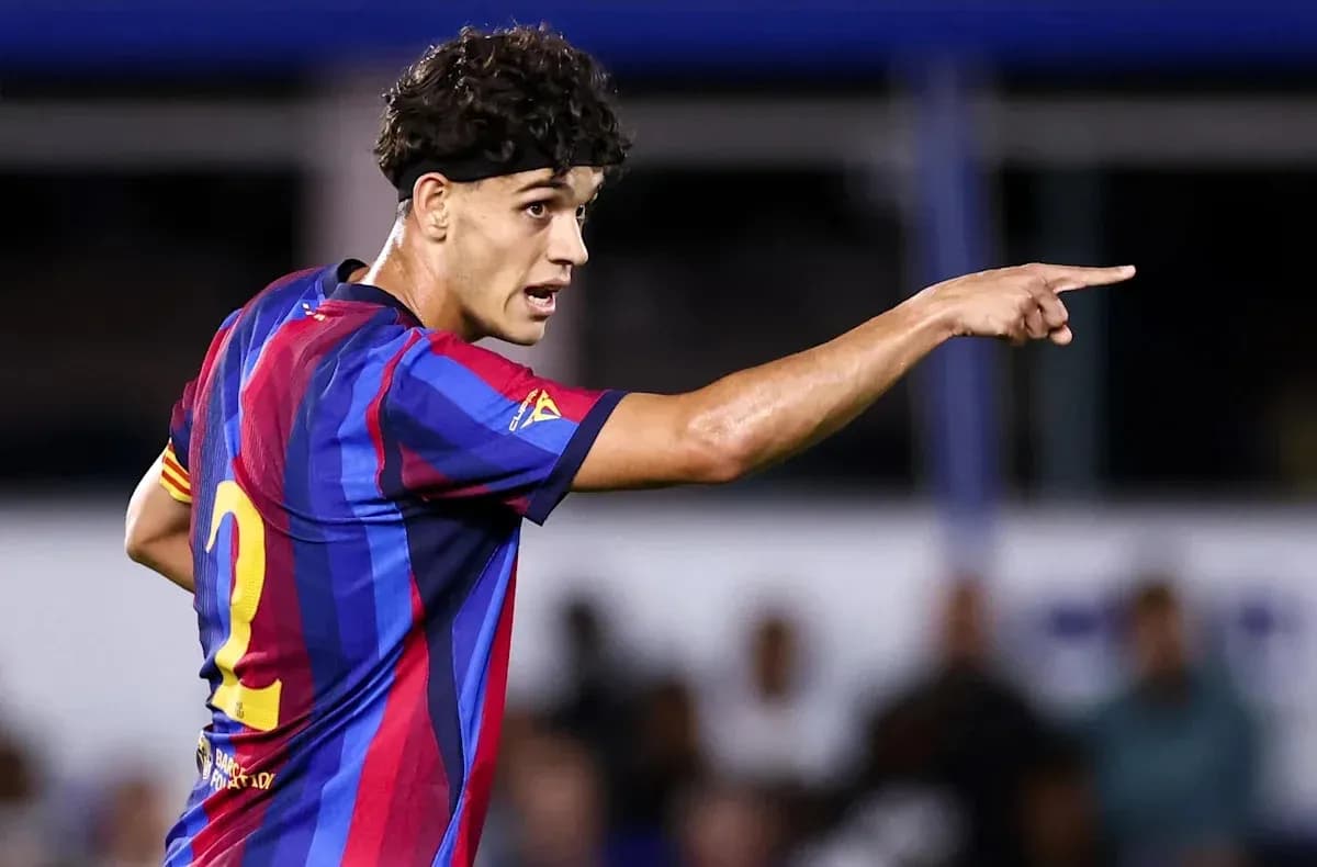 Player in FC Barcelona kit directing teammates during match Player in FC Barcelona kit directing teammates during match