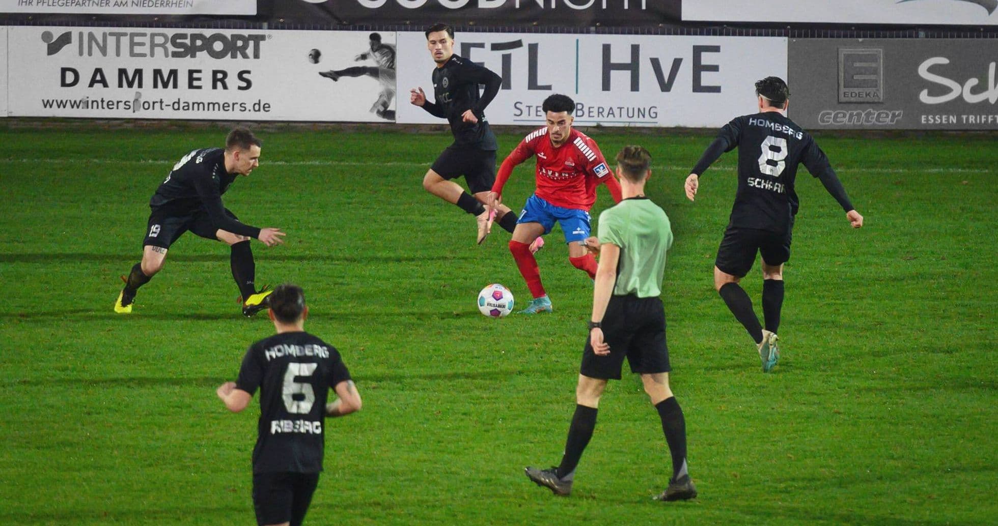 Players competing for the ball in Oberliga match Players competing for the ball in Oberliga match