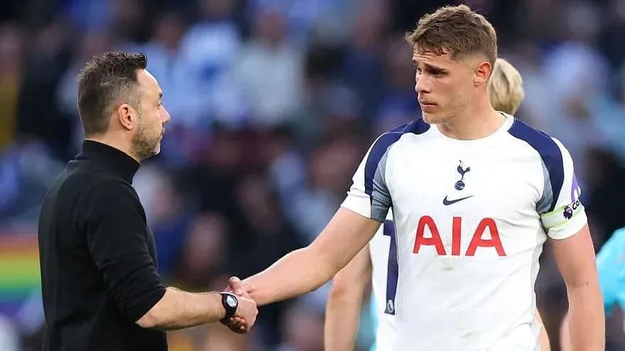 Manager shaking hands with player on pitch Manager shaking hands with player on pitch
