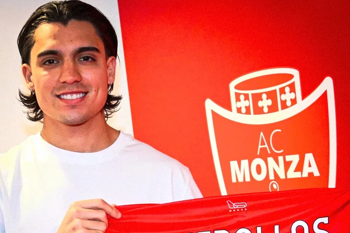 Player holding AC Monza scarf at announcement event Player holding AC Monza scarf at announcement event