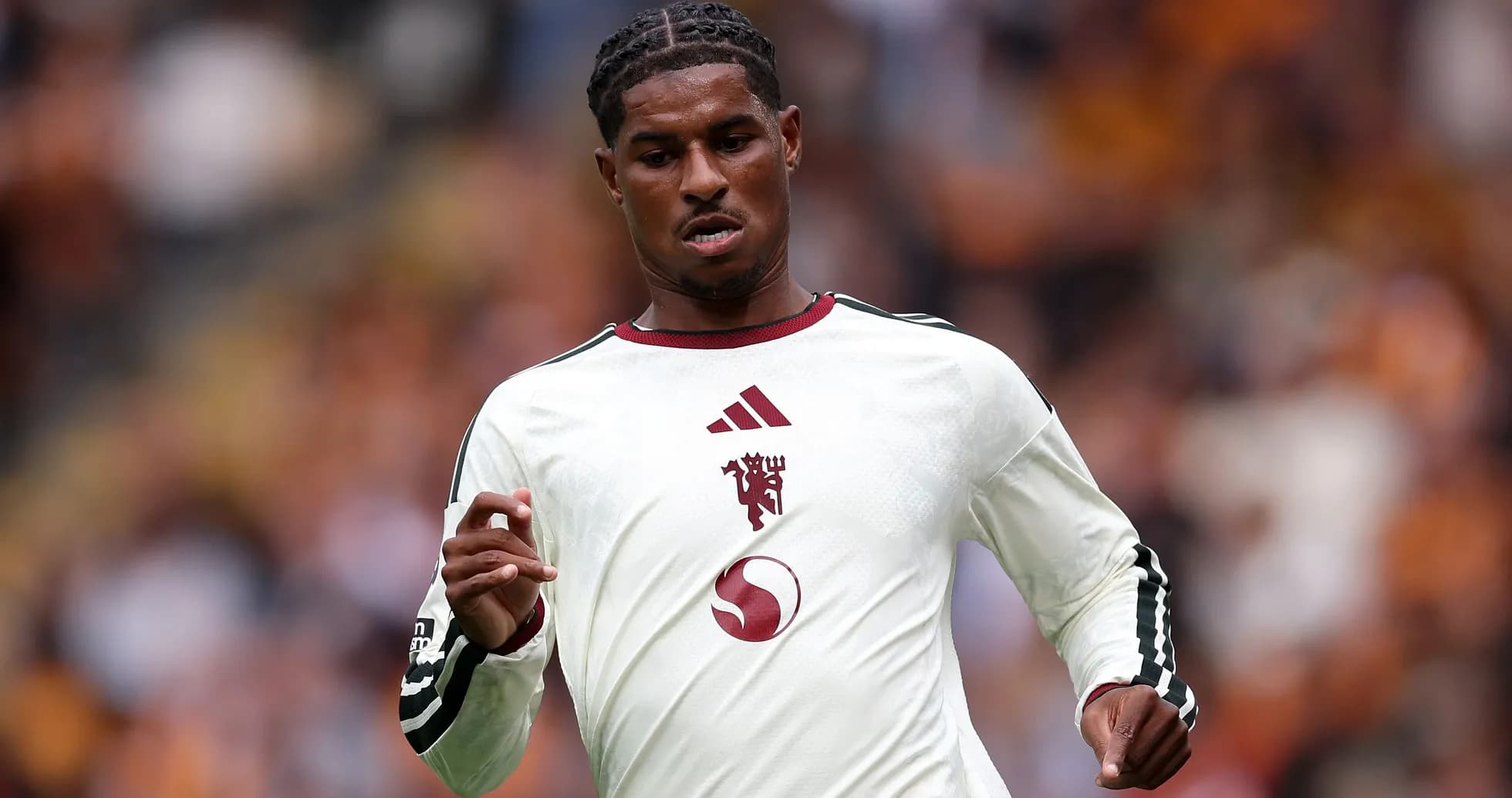 Player running on the pitch during a match Player running on the pitch during a match