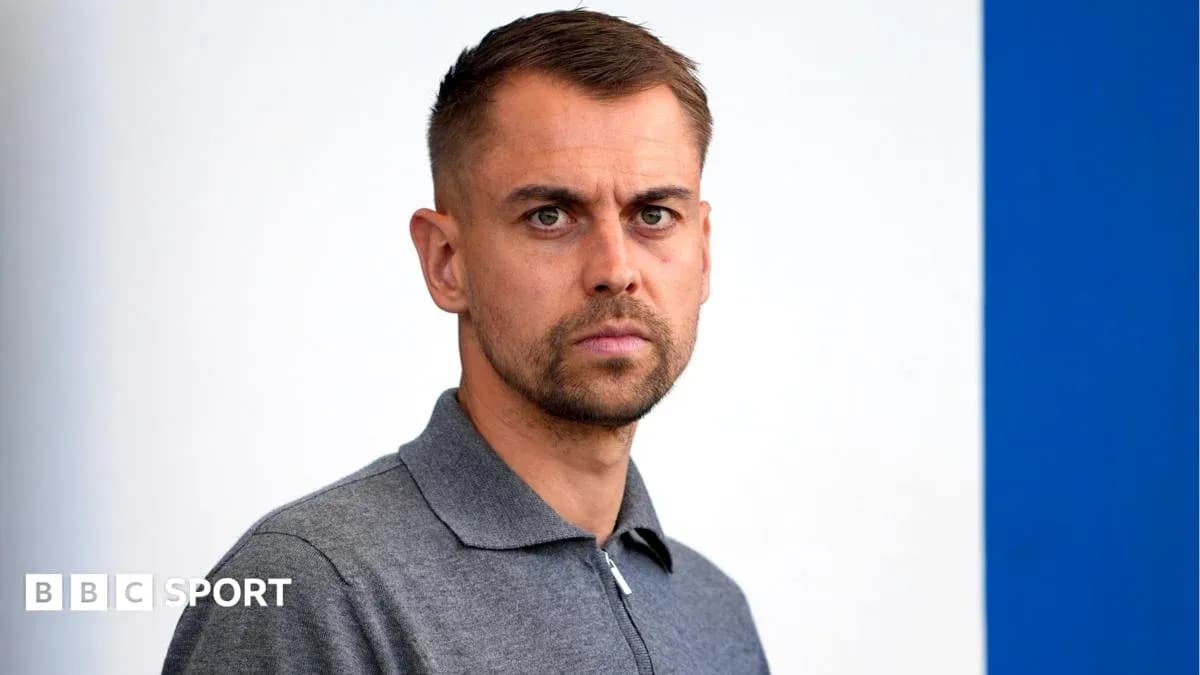 Man in gray polo shirt looking at camera Man in gray polo shirt looking at camera