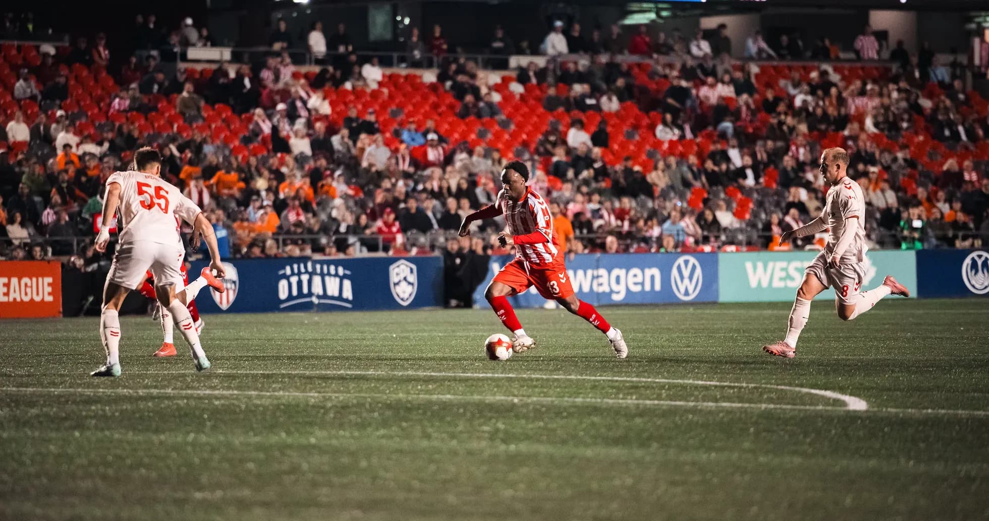 Player dribbling the ball during Ottawa vs Cavalry match Player dribbling the ball during Ottawa vs Cavalry match