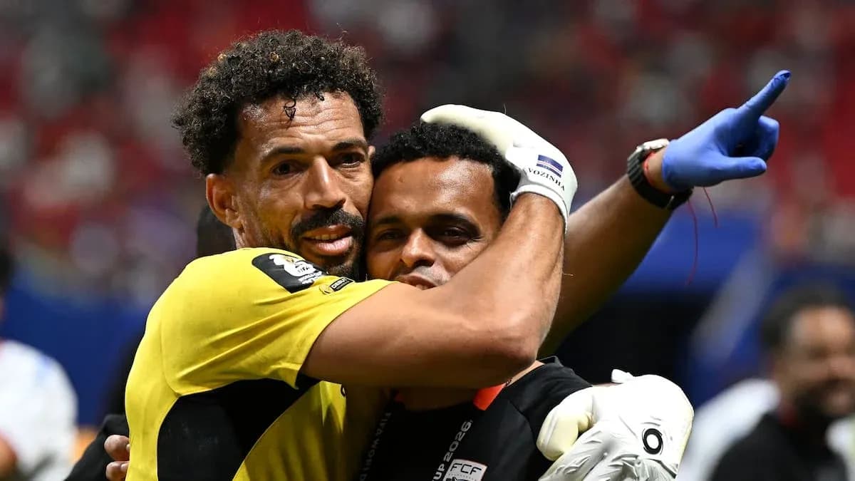 Goalkeeper celebrating with staff after match Goalkeeper celebrating with staff after match