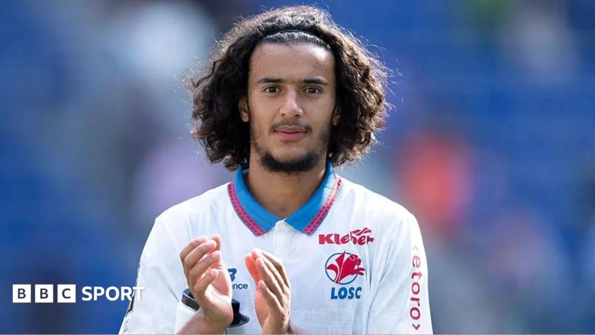 Player applauding fans after match in team jersey Player applauding fans after match in team jersey