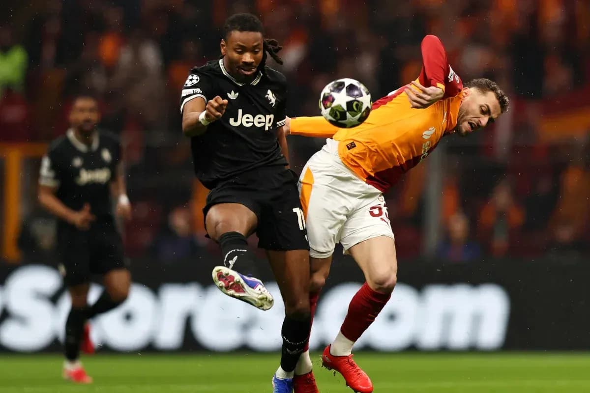 Two players contesting the ball during a match Two players contesting the ball during a match