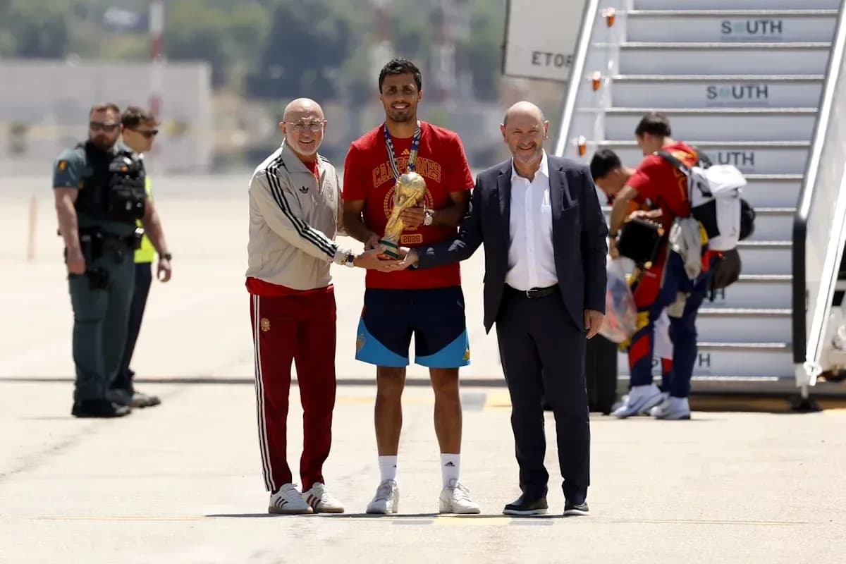 Player receiving trophy with officials at airport Player receiving trophy with officials at airport