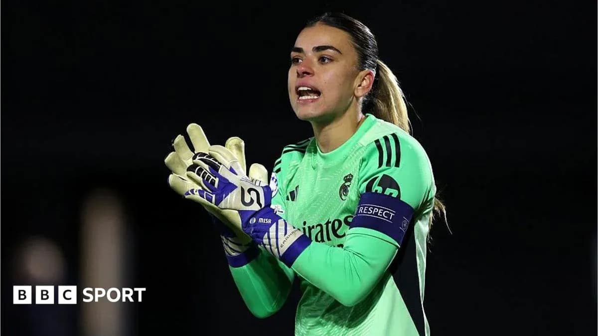 Goalkeeper in green jersey directing teammates during match Goalkeeper in green jersey directing teammates during match