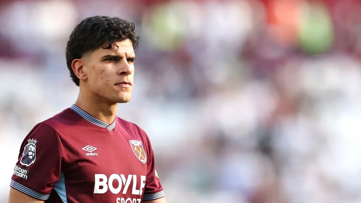 Player wearing West Ham United jersey on field Player wearing West Ham United jersey on field