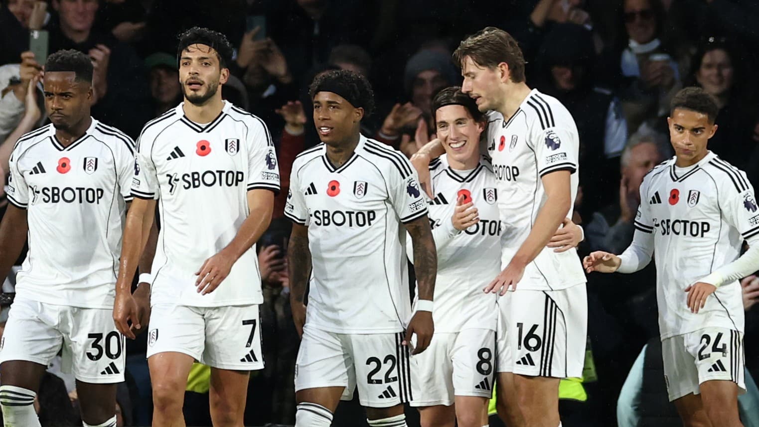 Fulham players celebrating a goal during match Fulham players celebrating a goal during match