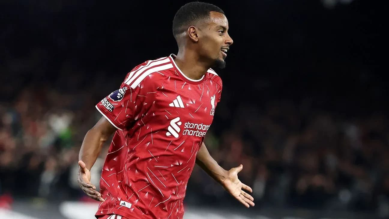 Player celebrating a goal in red team jersey Player celebrating a goal in red team jersey