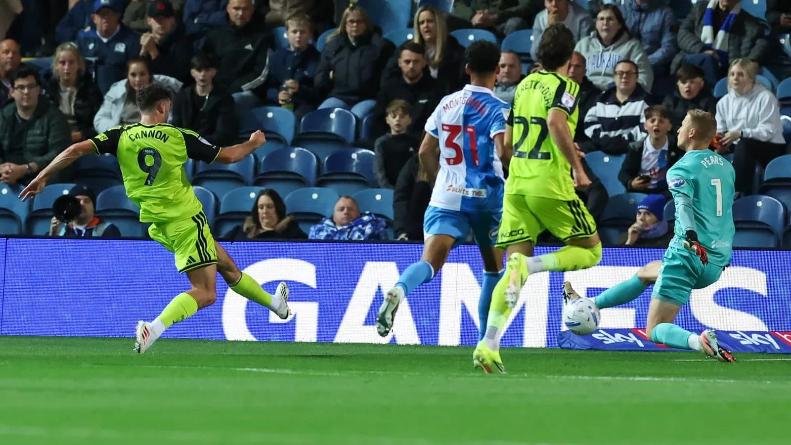 Player shooting at goal during football match Player shooting at goal during football match