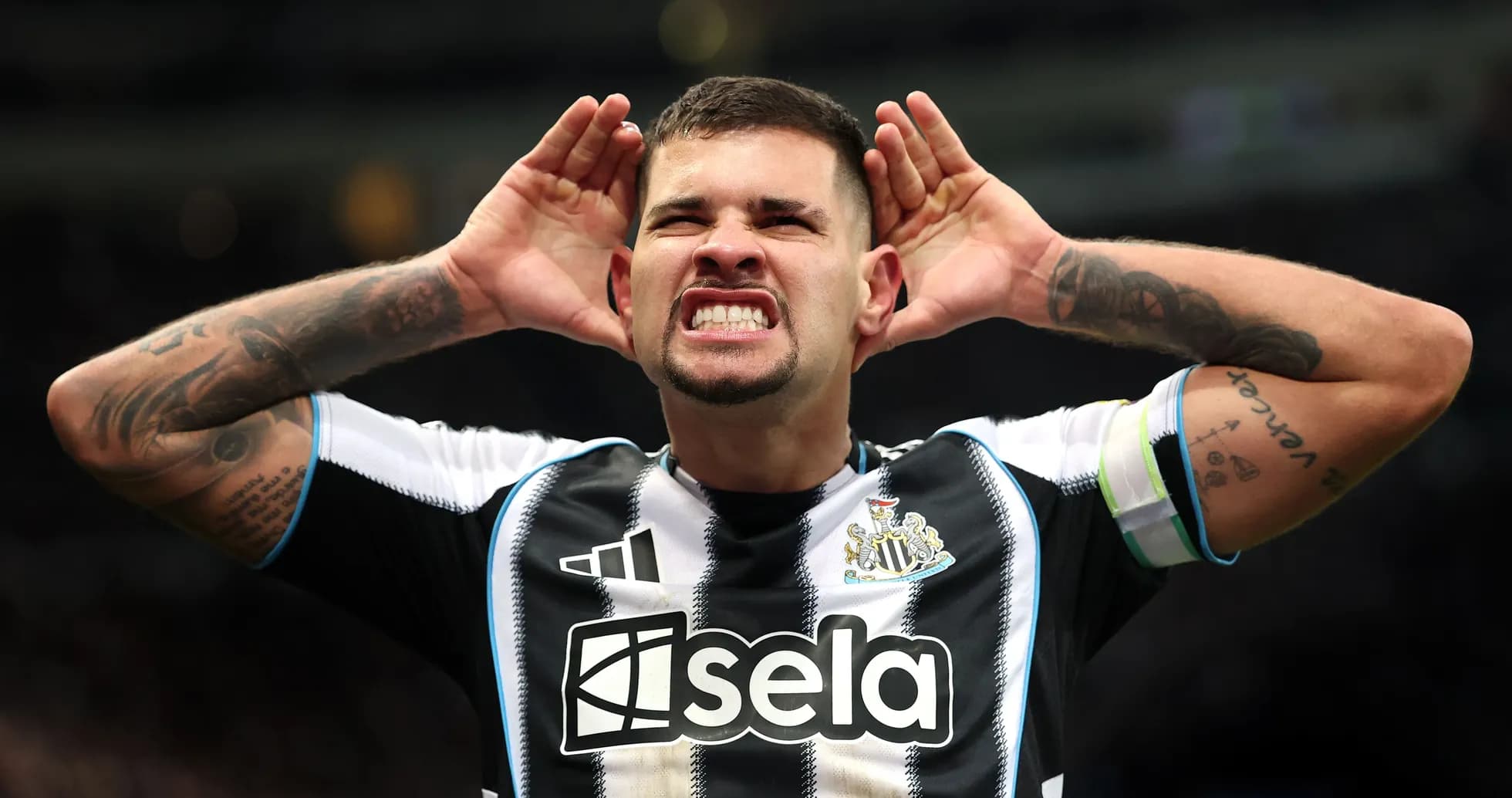 Player celebrating by cupping hands to ears Player celebrating by cupping hands to ears