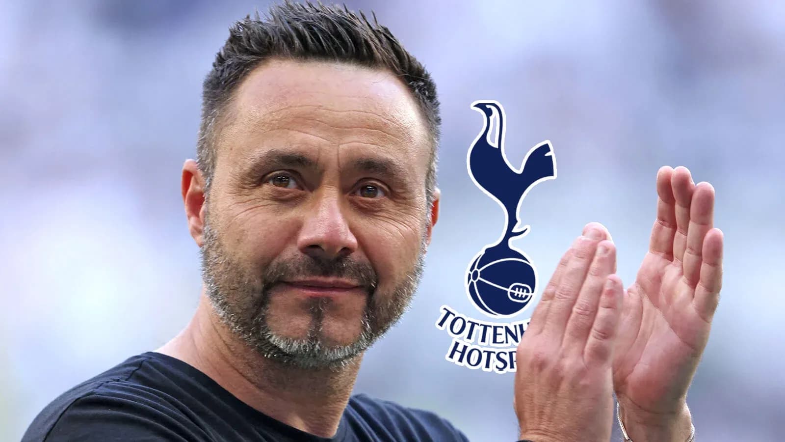 Coach applauding with Tottenham Hotspur logo in background Coach applauding with Tottenham Hotspur logo in background