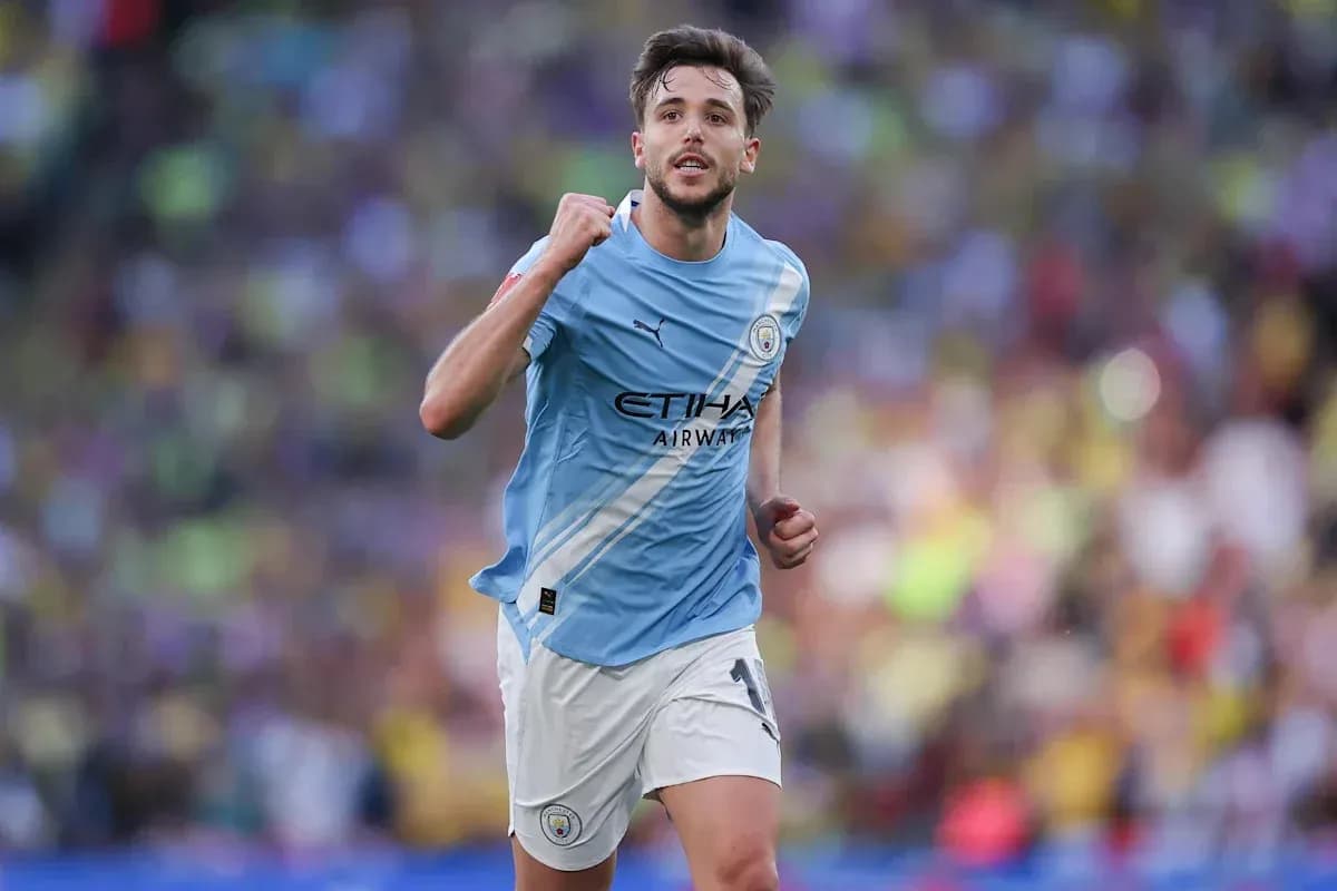 Player celebrating during match in light blue jersey Player celebrating during match in light blue jersey