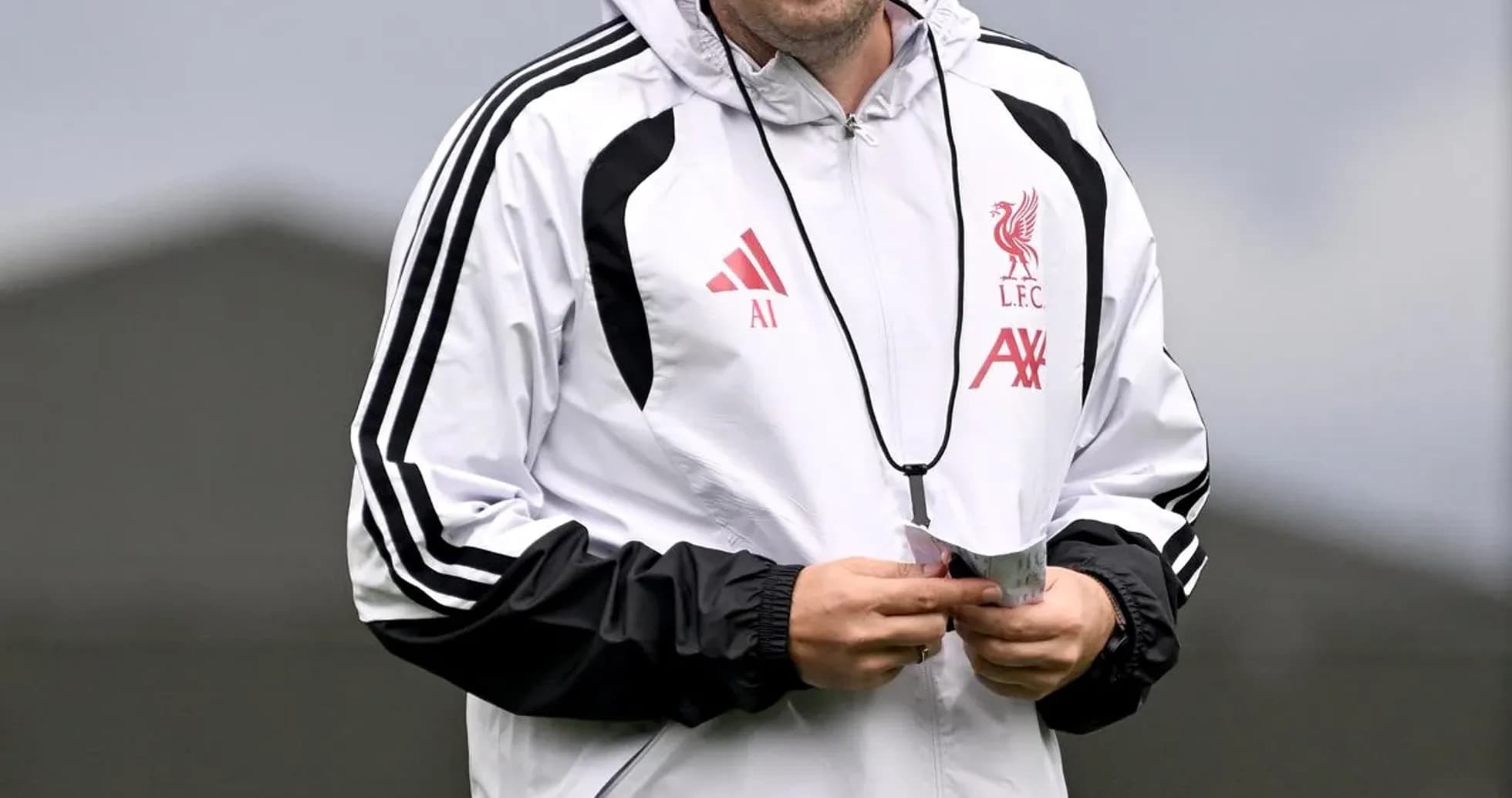 Coach walking during Liverpool training session Coach walking during Liverpool training session